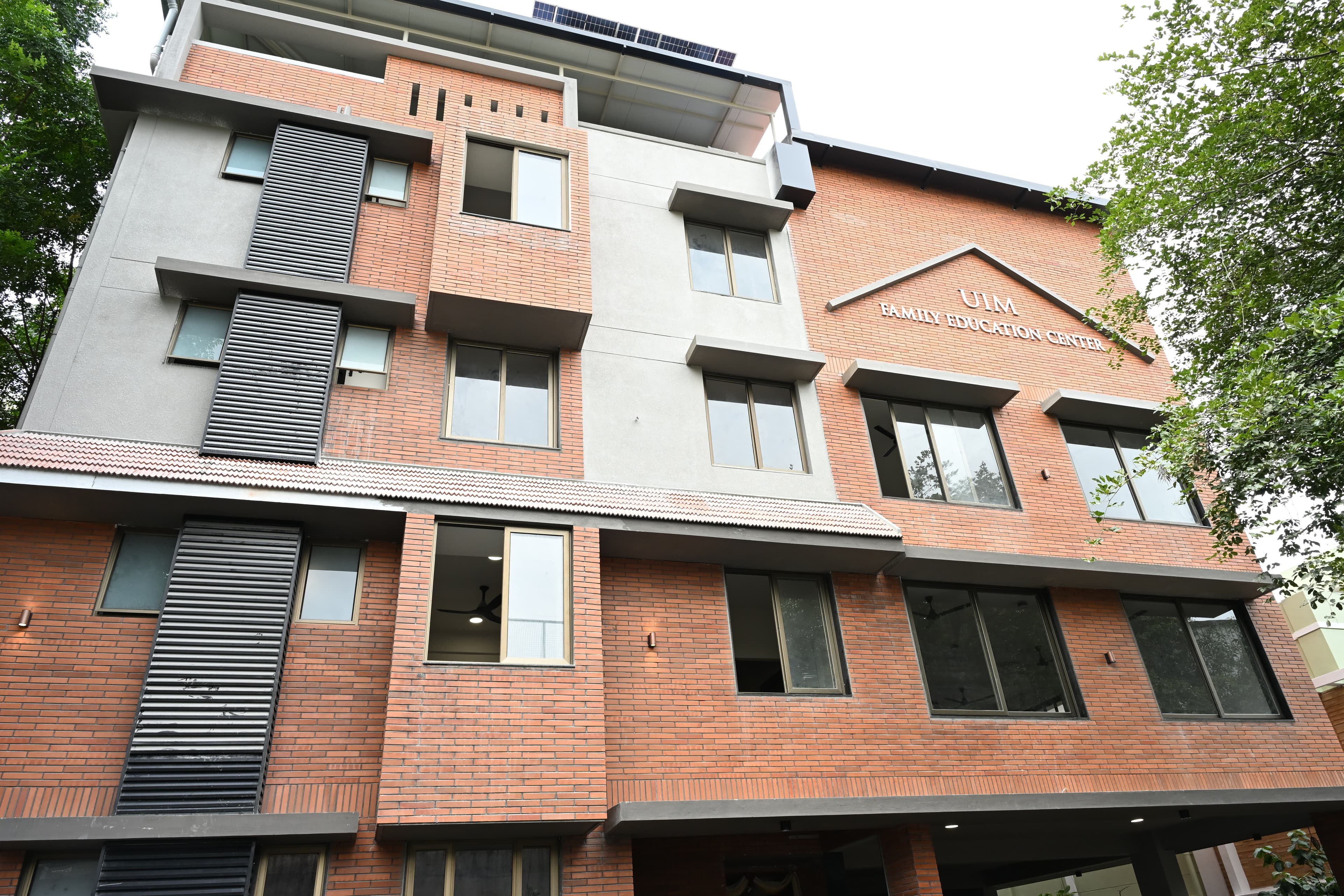 UIM Family Education Center — front view of the multi-storey brick building
